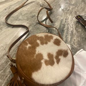 Circular cowhide crossbody purse